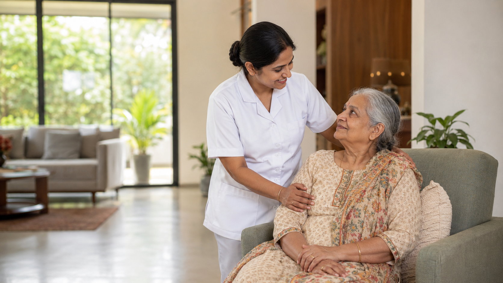 South Indian caregiver supporting an elderly woman at home in Bangalore